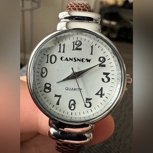 Women’s Cansnow quartz watch (Brand new) with spring loaded band.